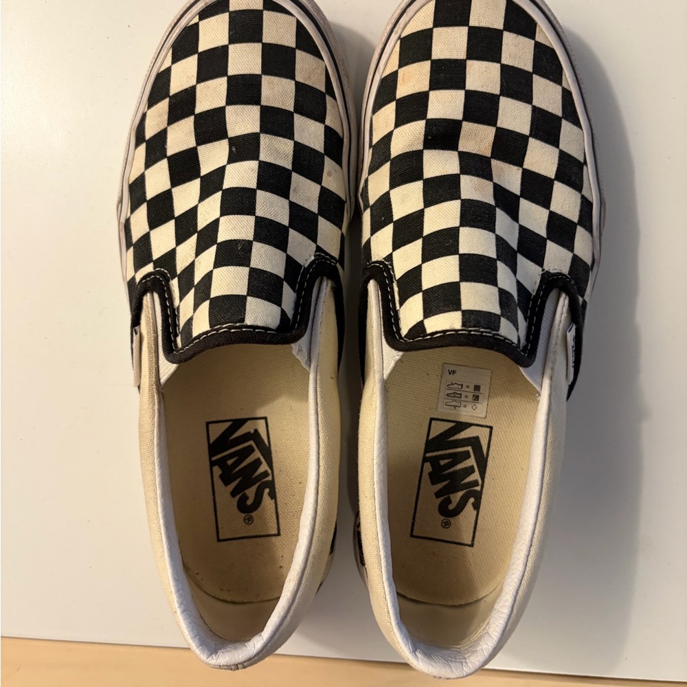Vans women Black and White Checkered Slip-On Sneakers
